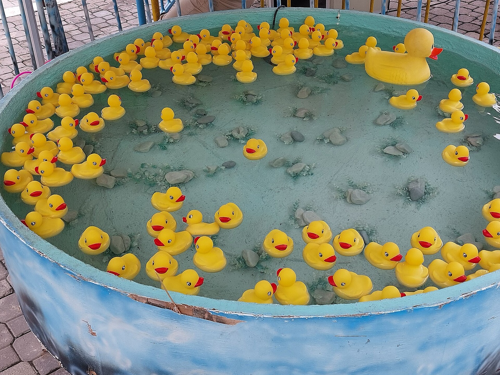 A pool filled with yellow rubber ducks at a carnival game in Anjo World, Minglanilla