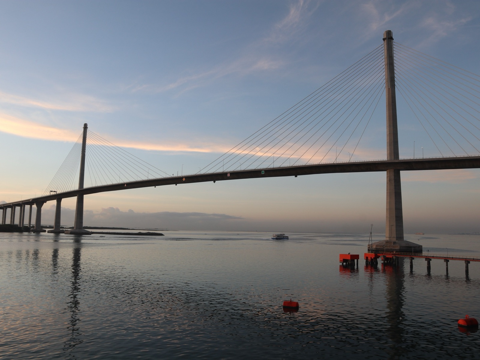 Sunrise over the CCLEX bridge and the sea between Mactan and Cebu City