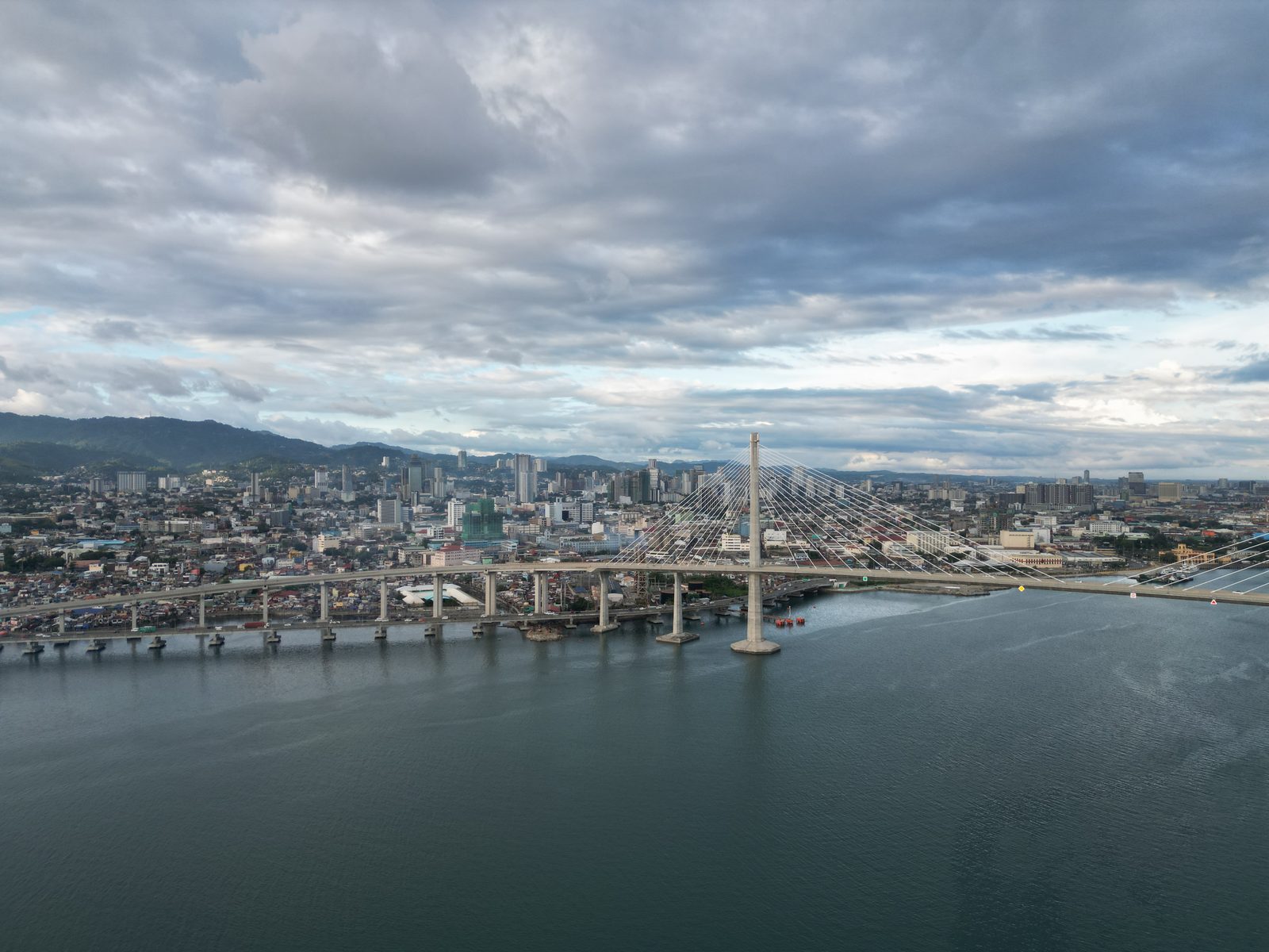 Cebu City skyline and the CCLEX bridge seen from the air over the channel